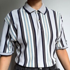 Thick striped Izod polo.